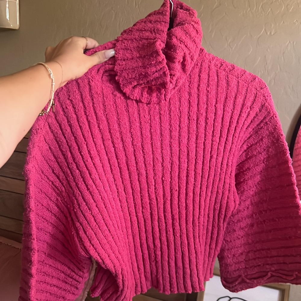 pink turtleneck sweater